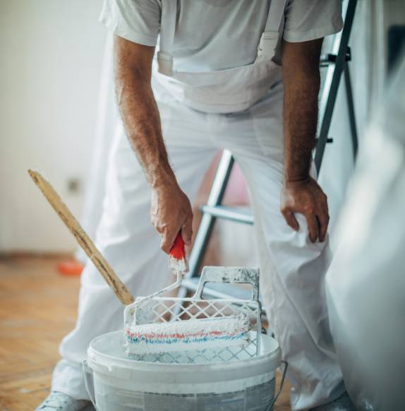 Painter using a paint roller